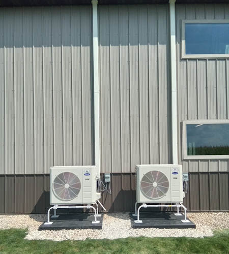 photo of two commercial minisplits installed shown by building exterior